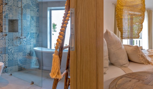 A view of the luxurious en suite bathroom and bedroom in the luxurious villa Bliss on Brač