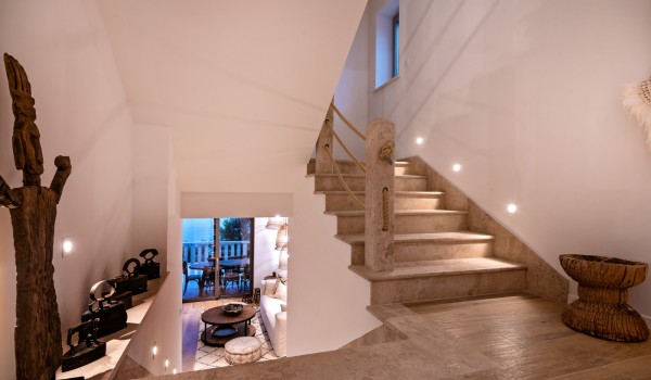 The view from the refined stairs to the living room of the luxury villa for family vacation Bliss