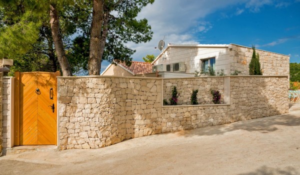 Stone exterior of luxury rental villa Brač for vacation and relax by the beach