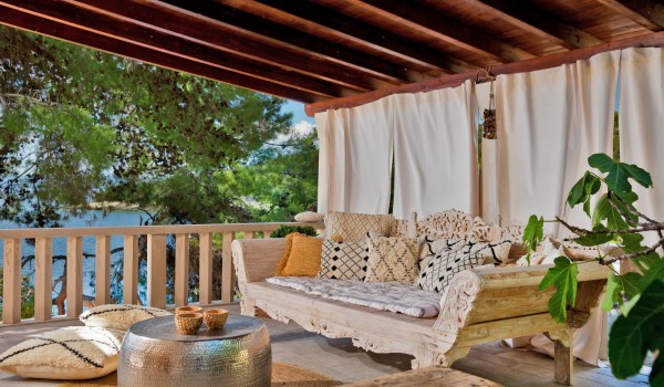 Covered outdoor terrace where you can enjoy the shade with the sounds of crickets and birds at a private holiday villa on the island of Brač