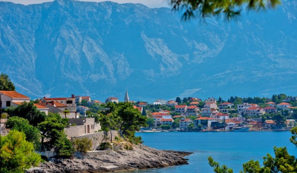 View of the beautiful Dalmatian town of Sumartin on the island of Brač from the property of the luxury villa for rent and vacation