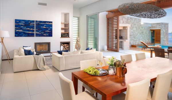 Interior of an elegantly decorated living room with a dining room of a luxury villa with a swimming pool by the sea Brela Pride in Brela with internet, SMART TV and private parking