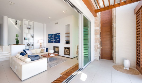 Airy living room with a fireplace in a private luxury holiday villa in Brela with chef service on request