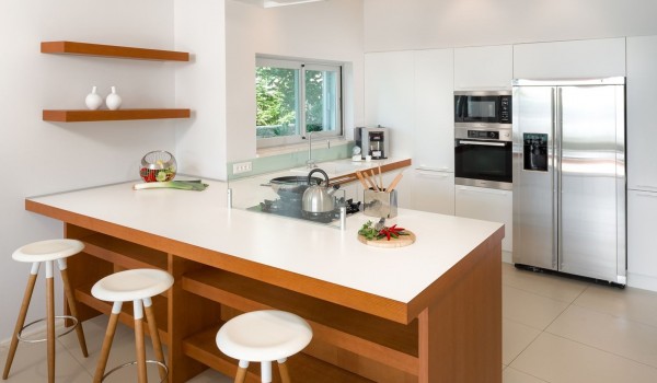 Fully equipped kitchen with an island, fridge, microwave, oven and coffee machine in a luxury pet-friendly villa for rent and vacation Brela Pride in Brela