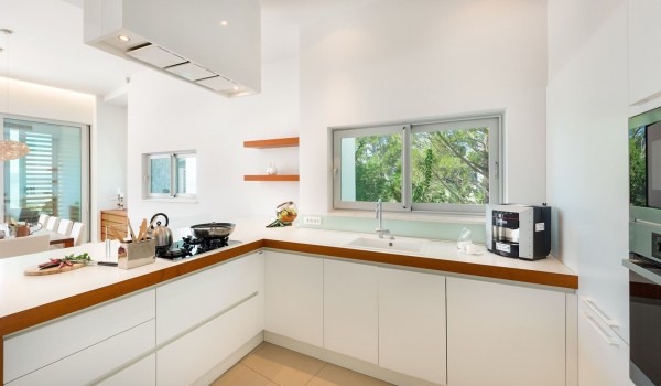 Elegant kitchen with an island for socializing with friends in a luxury villa for rent and vacation with family and friends in Brela