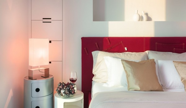 Elegantly decorated interior of an air-conditioned bedroom with a king size bed and SAT TV on the first floor of a luxury villa with a swimming pool for rent and vacation Brela Pride in Brela