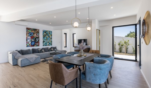 Inside of the Croatia family villa with living room area and dining table for vacation and rent in Razanj