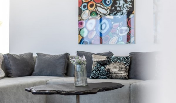 Living room area of the luxury pool villa Seven Seas with sofa and coffee table for rent with friends and family