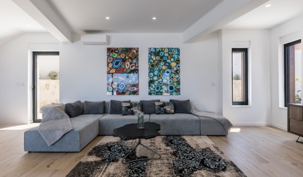 Living room area of Croatia pool villa with modern sofa and coffee table for vacation and rent