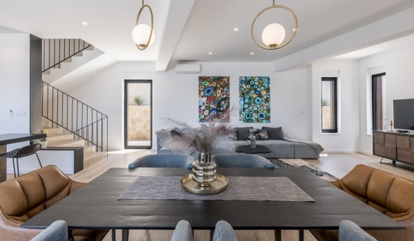 Inside of Croatia luxury pool villa with living room area and dining table for vacation and rent