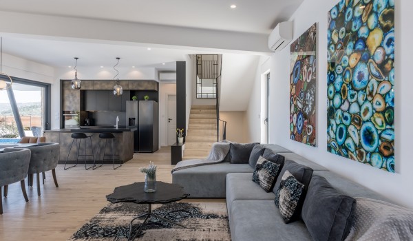 Living room area of the luxury family villa Seven Seas with sofa and coffee maker for vacation