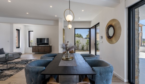 Dining area connected with living room in the luxury rental villa Seven Seas for family vacations