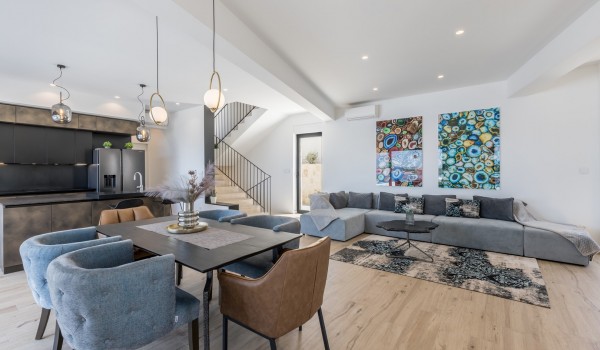 Dining area connected with living room in the luxury rental villa Seven Seas for family vacations