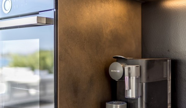 Fully equipped kitchen area with the coffee maker in the luxury sea view villa Seven Seas