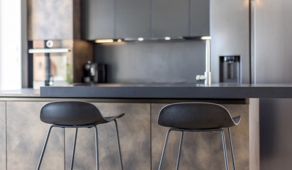 Fully equipped kitchen area of the luxury sea view villa with refrigerator and oven for family vacations