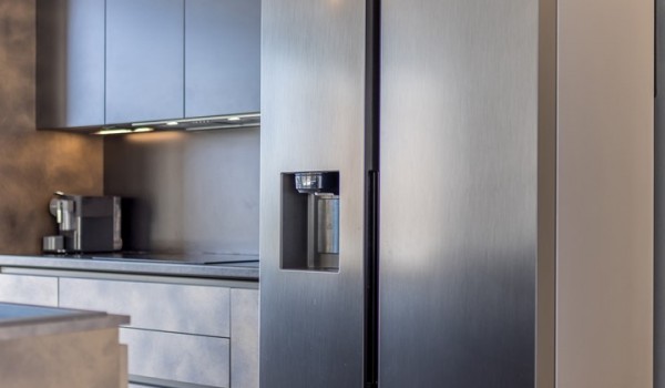 Fully equipped kitchen area of the luxury sea view villa with refrigerator and coffee maker for family vacations