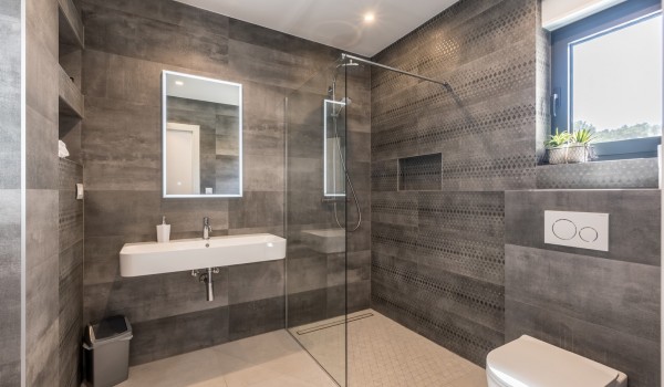 Luxury bathroom of Croatia family villa with shower cabin and sink for vacation and rent