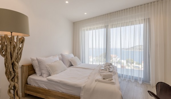 Bedroom of Croatia luxury holiday villa with king-size bed and sea view for rent in Razanj