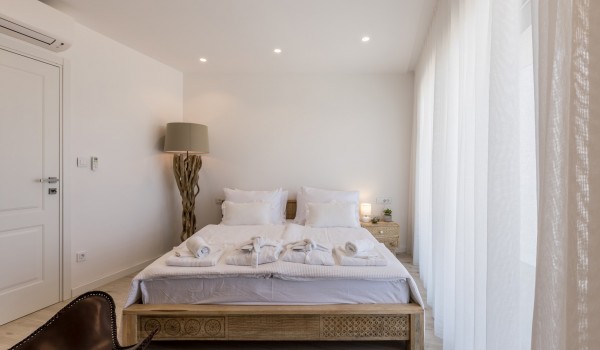 Bedroom of Croatia luxury pool villa with king-size bed and lamp for vacation and rent