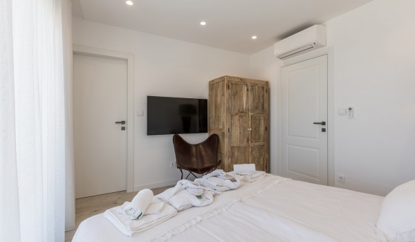Bedroom of Croatia luxury villa with king-size bed and SMART TV for family vacations