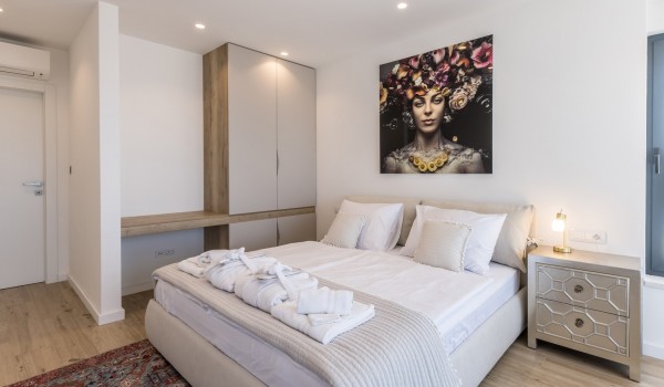 Modern bedroom of Croatia holiday villa in Razanj with king-size bed and closet space for rent