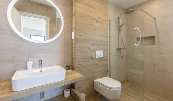 Modern bathroom of Croatia pool villa with shower and sink with mirror for family vacation