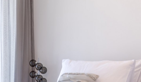 Bedroom of Croatia luxury holiday villa with king-size bed and night stand with lamp for rent