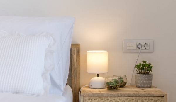 Bedroom of Croatia luxury holiday villa with king-size bed and night stand with lamp for rent