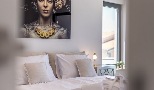 Bedroom of Croatia luxury holiday villa with king-size bed and night stand with lamp for rent