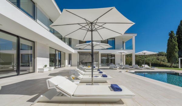 Sun loungers by the private pool of a Croatia luxury seafront villa Eden Land with sauna and jacuzzi in Istria