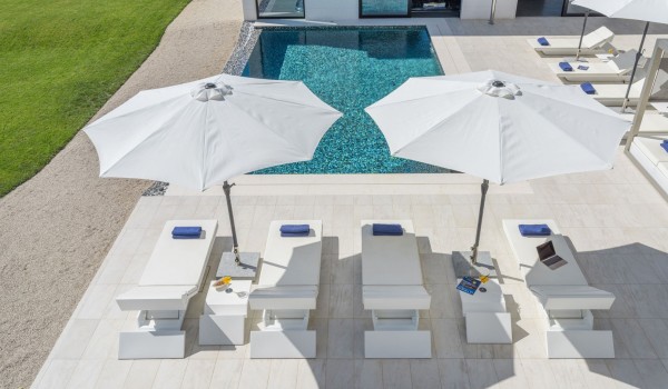 Sun loungers by the private pool of a Croatia luxury seafront villa Eden Land with sauna and jacuzzi in Istria