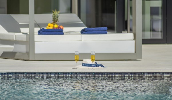 Sun loungers with sea view by the private pool of a Croatia luxury seafront villa Eden Land with sauna and jacuzzi in Istria