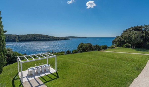 Outdoor dining table in the garden of a Croatia luxury pet-friendly villa Eden Land with total privacy in Istria