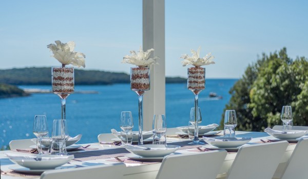 Outdoor dining table in the garden of a Croatia luxury pet-friendly villa Eden Land with total privacy in Istria