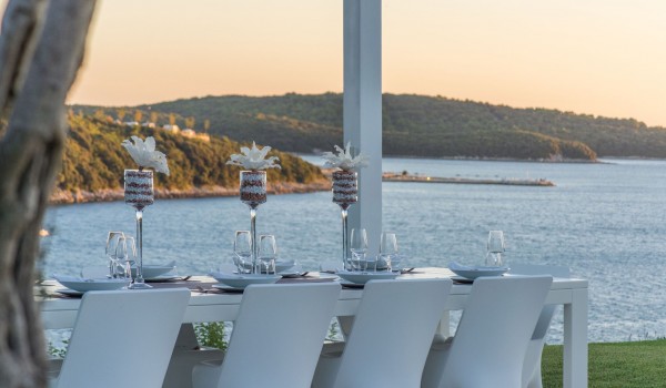 Outdoor dining table in the garden of a Croatia luxury pet-friendly villa Eden Land with total privacy in Istria