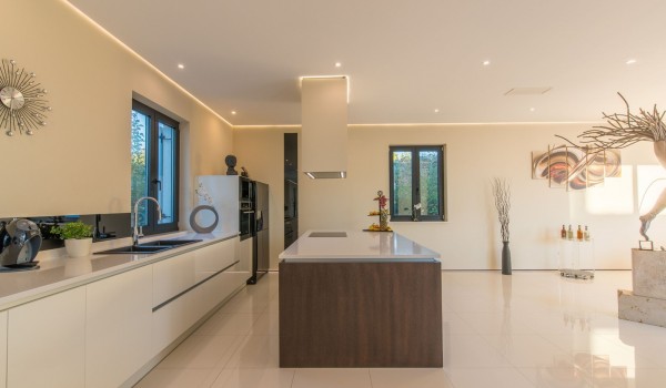 Fully equipped kitchen with kitchen island in a Croatia luxury seafront villa for vacation and rent in Istria