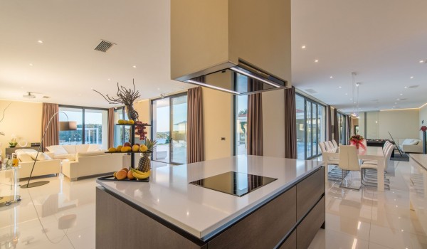 Fully equipped kitchen with kitchen island in a Croatia luxury seafront villa for vacation and rent in Istria