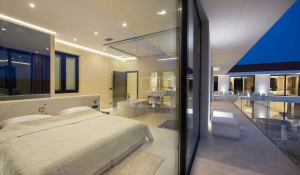 King size bed in a bedroom with en suite bathroom and sea view in a Croatia luxury villa Eden Land in Istria