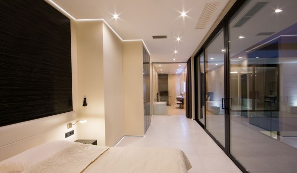 King size bed in a bedroom with en suite bathroom and sea view in a Croatia luxury villa Eden Land in Istria