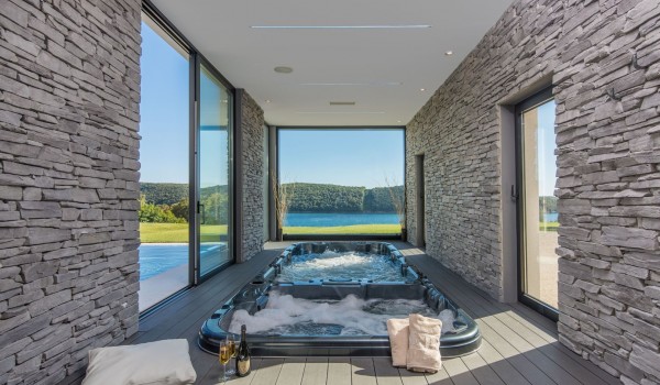 Indoor jacuzzi and pool in a Croatia luxury seafront villa with concierge service and parking in Istria
