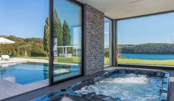 Indoor jacuzzi and pool in a Croatia luxury seafront villa with concierge service and parking in Istria