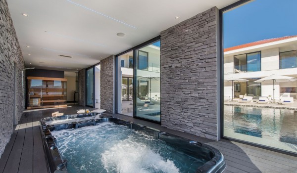 Indoor jacuzzi and pool in a Croatia luxury seafront villa with concierge service and parking in Istria