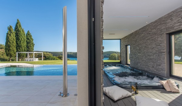 Indoor jacuzzi and pool in a Croatia luxury seafront villa with concierge service and parking in Istria