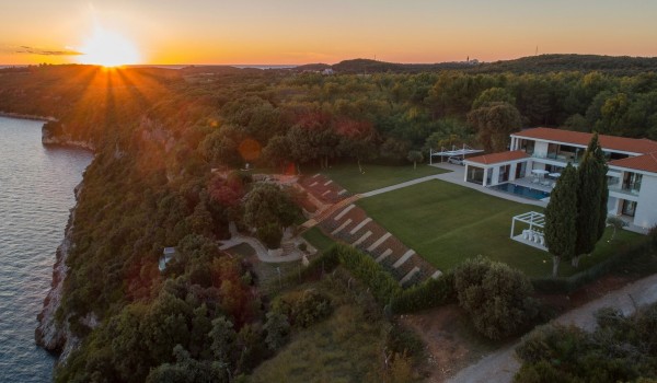 Night view of a Croatia luxury seafront villa with private parking and sauna in Istria
