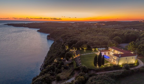 Night view of a Croatia luxury seafront villa with private parking and sauna in Istria