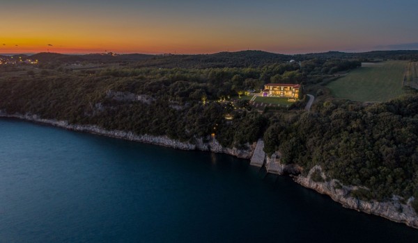 Night view of a Croatia luxury seafront villa with private parking and sauna in Istria