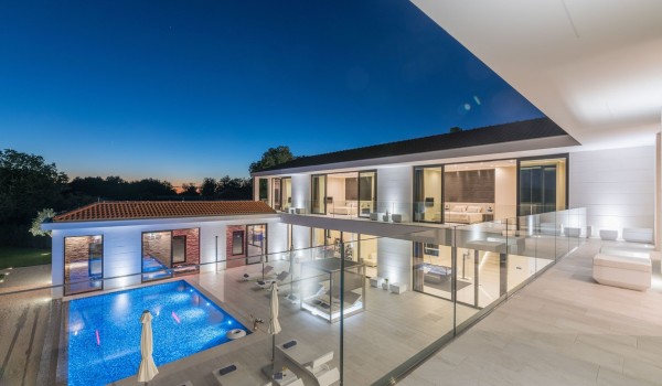 Night view of a Croatia luxury seafront villa with private parking and sauna in Istria