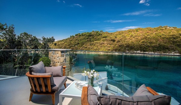 A place to sit and relax on the balcony of the luxury villa Korcula Prestige with a view of the sea on the island of Korcula
