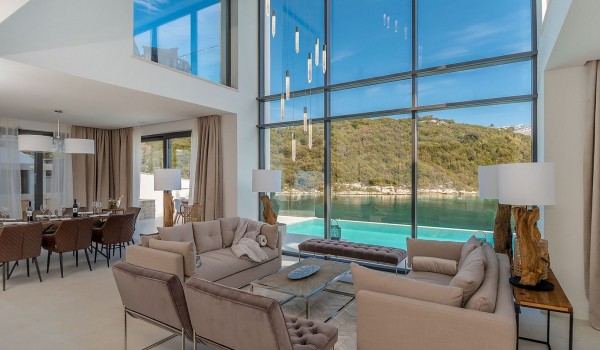 View of the private pool and the sea from the living room of the luxury villa Korcula Prestige on the island of Korčula