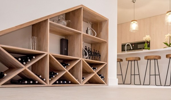 A wooden shelf with wine in a luxury Korcula Prestige villa with a private pool on the island of Korcula
